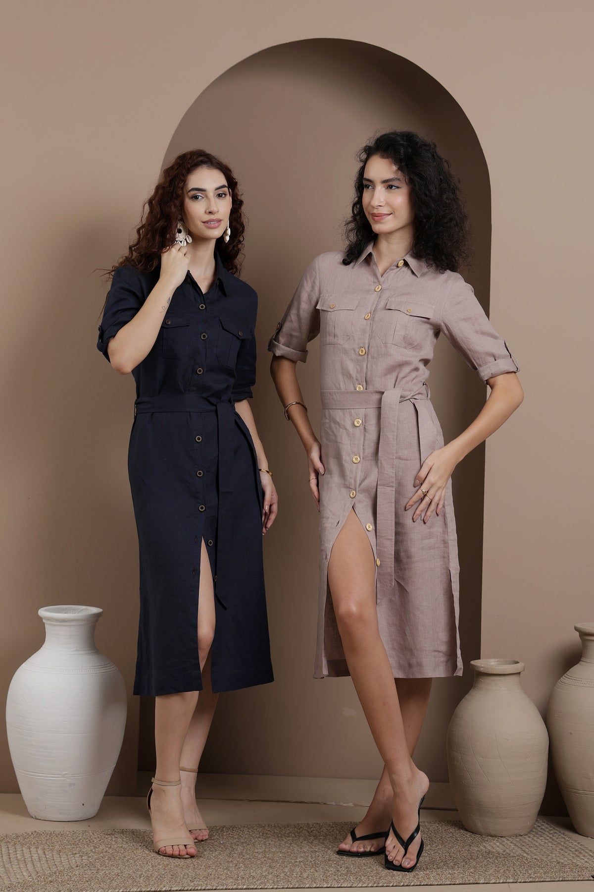 Two women wearing button-up linen shirt-dresses