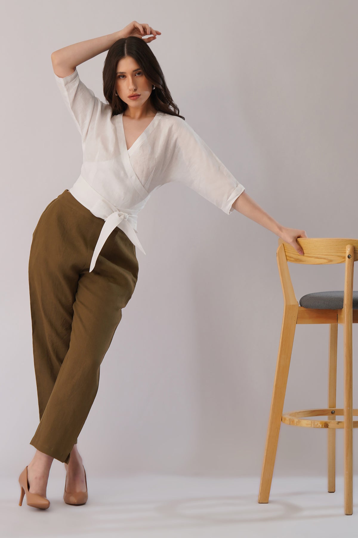 young lady in linen wrap top blouse