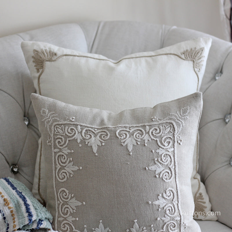 intricate embroidery on linen pillows